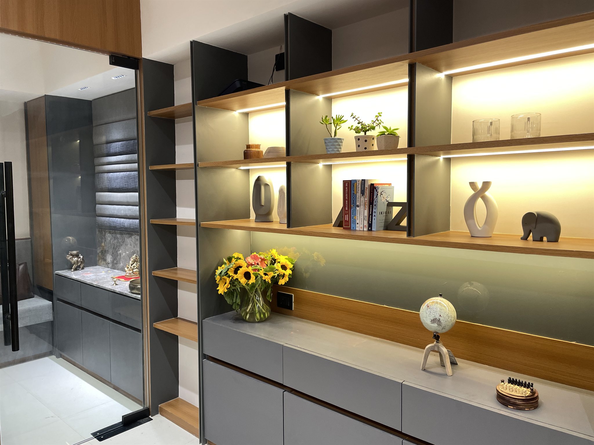 Advocate's office display unit with lit wooden shelves